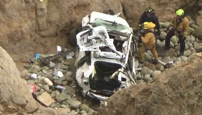 Man Intentionally Drives Tesla Off Cliff With Family Inside, Wife Says