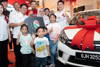 KK Boy Helps Mother Win Perodua Axia in Lucky Draw at Suria Sabah