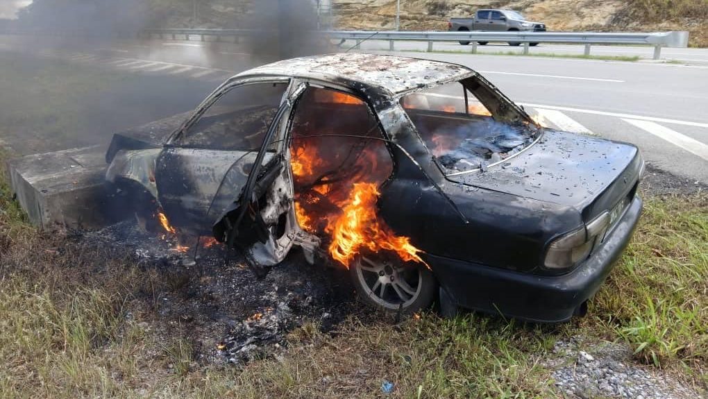 Narrow Escape Man and Boy Survive Fiery Car Crash in Kampung Singai